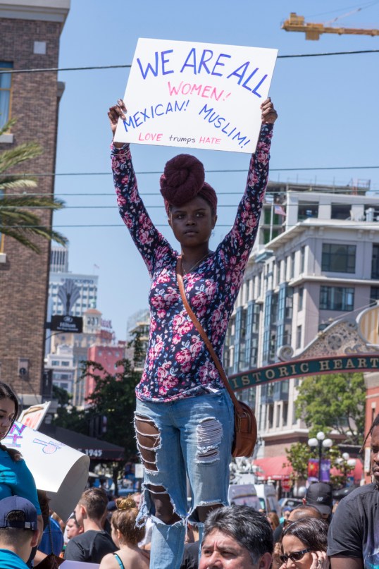 Afro American woman with sign at protest